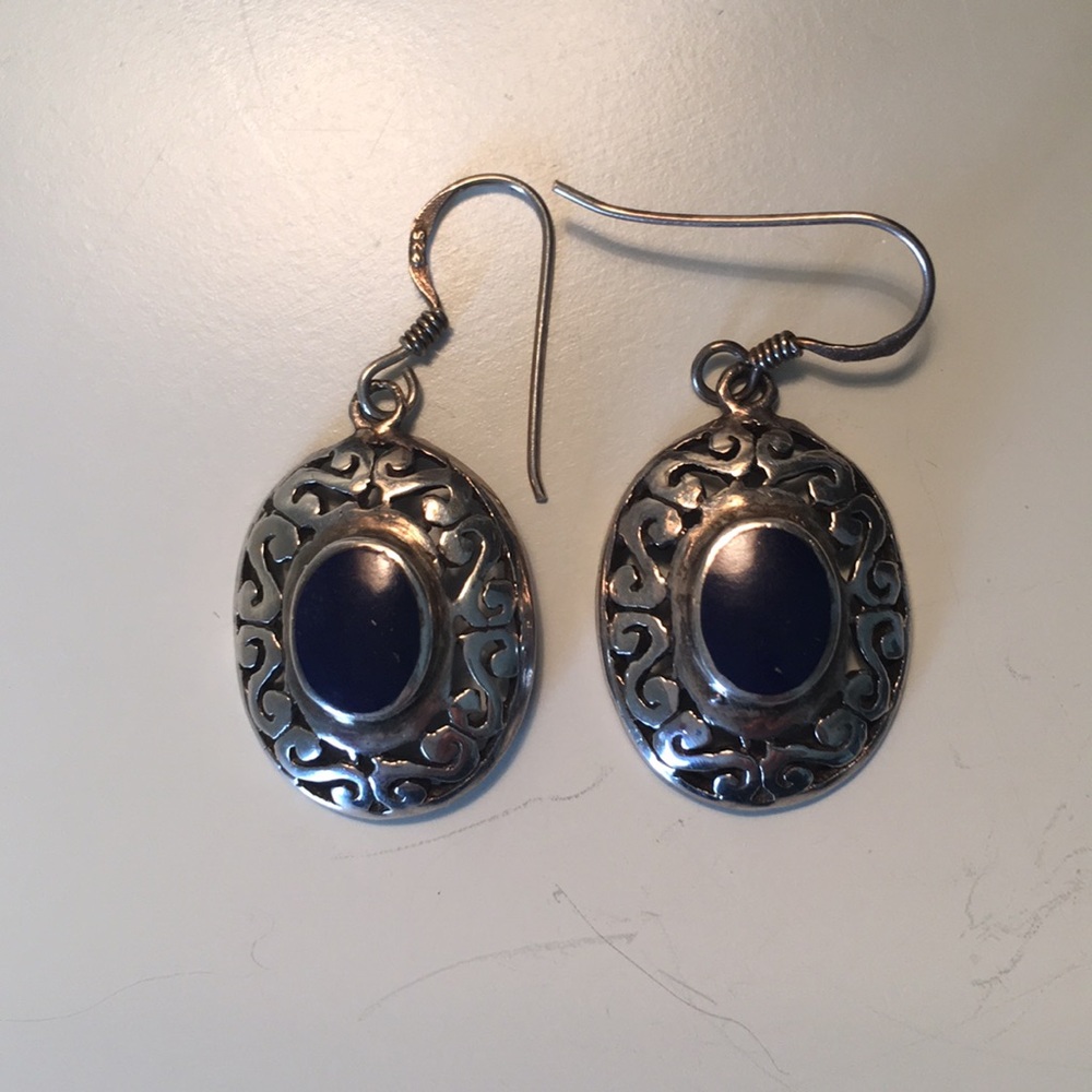 Silver and lapis colored earrings.